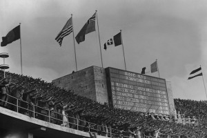 The crowd gives the Nazi salute at the Berlin Olympic games, August 1936. On the scoreboard are the results of the men's 1500 metre final. (Photo by Central Press/Hulton Archive/Getty Images)